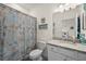 Coastal-themed bathroom with a shower/tub combo and granite vanity at 43356 Waymark Pl, Punta Gorda, FL 33982