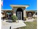 Inviting front entrance with a metal security door and landscaping at 54 Triangle St, Port Charlotte, FL 33954