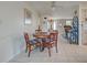 Casual dining area with a round wooden table and four chairs at 6245 Freemont St, North Port, FL 34287