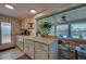 Bright kitchen with view into the sunroom and backyard at 6245 Freemont St, North Port, FL 34287