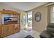 Living room with a TV stand and a view of the front door at 6245 Freemont St, North Port, FL 34287