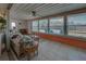 Relaxing sunroom with wicker furniture and view of backyard at 6245 Freemont St, North Port, FL 34287