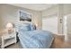 Guest bedroom with a full-size bed, nightstand and built-in closet at 80 Long Meadow Pl, Rotonda West, FL 33947