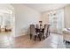 Spacious dining area with a wooden table and six chairs at 10721 Banfield Dr, Riverview, FL 33579