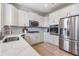 Modern kitchen with stainless steel appliances and white cabinetry at 10721 Banfield Dr, Riverview, FL 33579