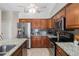 Modern kitchen with stainless steel appliances and granite countertops at 1081 Fleetwood Nw Dr, Port Charlotte, FL 33948