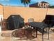 Small patio with table, chairs, and grill at 1345 Mediterranean Dr # A203, Punta Gorda, FL 33950