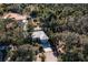 Single-story home with metal roof, surrounded by lush Florida landscape at 17221 Elder Ave, Port Charlotte, FL 33954