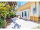 Private backyard patio with seating area amidst lush landscaping at 17221 Elder Ave, Port Charlotte, FL 33954