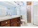 Clean bathroom with wood cabinets and a glass shower door at 17221 Elder Ave, Port Charlotte, FL 33954