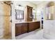 Elegant bathroom with double vanity, granite counters and large shower at 17221 Elder Ave, Port Charlotte, FL 33954