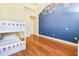 bedroom with a white bunk bed and a blue accent wall at 17221 Elder Ave, Port Charlotte, FL 33954