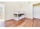 Small bedroom with a white bunk bed and wood floors at 17221 Elder Ave, Port Charlotte, FL 33954