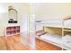 Bright bedroom with a white bunk bed and wood floors at 17221 Elder Ave, Port Charlotte, FL 33954