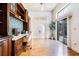 Home office with built-in wooden desk and hardwood floors at 17221 Elder Ave, Port Charlotte, FL 33954