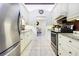 Bright kitchen boasts granite countertops and stainless steel appliances at 17221 Elder Ave, Port Charlotte, FL 33954