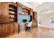 Home office with built-in desk, wood cabinetry, and access to living area at 17221 Elder Ave, Port Charlotte, FL 33954