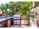 Outdoor kitchen with built-in grill, pizza oven, and sink at 17221 Elder Ave, Port Charlotte, FL 33954
