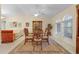 Elegant dining room with a wooden table and arched windows at 17466 Fuego Ln, Punta Gorda, FL 33955