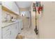 Bright, spacious laundry room with white cabinets, utility sink, and washer/dryer at 17466 Fuego Ln, Punta Gorda, FL 33955
