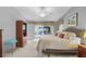 Spacious main bedroom with sliding glass doors leading to the pool area at 17466 Fuego Ln, Punta Gorda, FL 33955