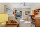 Home office with a view of the pool through the sliding glass doors at 17466 Fuego Ln, Punta Gorda, FL 33955