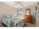 Bedroom with double bed, dresser, and ceiling fan at 18835 Ashcroft Cir, Port Charlotte, FL 33948