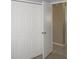Large bedroom closet with white doors and neutral walls at 21471 Dranson Ave, Port Charlotte, FL 33952