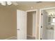 Bedroom with doors to another room and a bathroom at 21471 Dranson Ave, Port Charlotte, FL 33952
