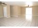 Spacious living room with tile floors and ceiling fans at 21471 Dranson Ave, Port Charlotte, FL 33952