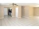Living room, kitchen, and dining area with tile floors at 21471 Dranson Ave, Port Charlotte, FL 33952
