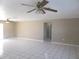 Living room with tile floors and ceiling fans at 21471 Dranson Ave, Port Charlotte, FL 33952