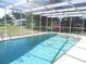 Refreshing screened-in pool, perfect for relaxation at 21471 Dranson Ave, Port Charlotte, FL 33952