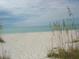 Scenic view of the beach with white sand and seagrass at 219 White Marsh Ln, Rotonda West, FL 33947