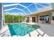 Inviting screened-in pool with plenty of space for relaxation at 219 White Marsh Ln, Rotonda West, FL 33947