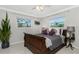 Bedroom with a sleigh bed, neutral color scheme, and ample natural light at 241 Sorrento Ct, Punta Gorda, FL 33950