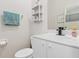 Small bathroom with white vanity and toilet at 3948 La Costa Island Ct, Punta Gorda, FL 33950