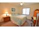 Cozy bedroom with a queen-size bed and built-in desk at 4048 Oakview Dr # F2-4, Punta Gorda, FL 33980