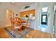 Dining area with hardwood floors and a wooden table with four chairs at 4048 Oakview Dr # F2-4, Punta Gorda, FL 33980