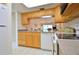 Kitchen boasts light wood cabinets and a dishwasher at 4048 Oakview Dr # F2-4, Punta Gorda, FL 33980