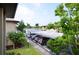 Covered parking area with lake view and landscaped grounds at 4048 Oakview Dr # F2-4, Punta Gorda, FL 33980