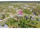 High-angle aerial view of the house among other properties in the neighborhood at 4317 Eldron Ave, North Port, FL 34286