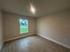 Bright bedroom with tile flooring and a large window providing natural light and views of the outdoors at 507 San Ambrosio St, Punta Gorda, FL 33983