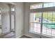Bright foyer with large windows offering natural light, neutral paint, and modern tile flooring creates an inviting entrance at 507 San Ambrosio St, Punta Gorda, FL 33983