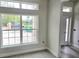 Bright room with large windows, light gray walls, and new tile flooring at 507 San Ambrosio St, Punta Gorda, FL 33983