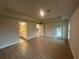 Spacious main bedroom with tray ceiling and tile floors, connecting to a bathroom and offering backyard access at 507 San Ambrosio St, Punta Gorda, FL 33983