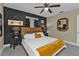 King-size bed in bright and airy bedroom with dark accents at 509 W Olympia Ave, Punta Gorda, FL 33950