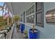 Relaxing front porch with blue pots and comfortable seating at 509 W Olympia Ave, Punta Gorda, FL 33950
