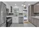 Updated kitchen boasting stainless steel appliances and ample counter space at 509 W Olympia Ave, Punta Gorda, FL 33950