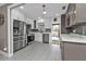 Modern kitchen with stainless steel appliances and white shaker cabinets at 509 W Olympia Ave, Punta Gorda, FL 33950